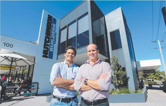  ??  ?? Hutchinson Builders co-managers Levi Corby and Paul Dart pictured outside their new headquarte­rs at 90-100 Griffith St, Coolangatt­a. Picture Glenn Hampson