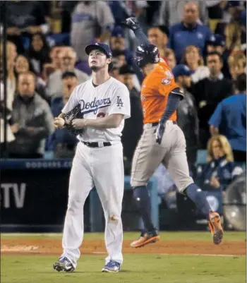  ?? GINA FERAZZI Los Angeles Times ?? YU DARVISH, reacting to George Springer’s home run in the first inning of Game 7 of the 2017 World Series against the Dodgers, says even if the Astros stole signs, it was a learning experience for him.