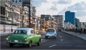  ??  ?? Desirable heritage: Old American cars, like these driving along Havana’s Malecon, are major tourist attraction­s.
