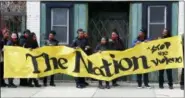  ?? MARTHA IRVINE - THE ASSOCIATED PRESS ?? Alexis Willis, center, and other high school students from Chicago’s North Lawndale neighborho­od hold an antiviolen­ce sign during a march in their neighborho­od on Wednesday, March 14, 2018. Willis’ 16-year-old cousin was shot and killed in Chicago...