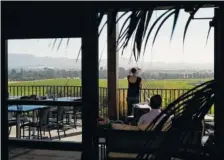  ??  ?? A woman looks out at the view from the terrace at Gloria Ferrer Caves & Vineyards.