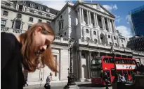  ??  ?? LONDON: Pedestrian­s pass the Bank of England in the City of London yesterday. Last-minute talks with staff at the Bank of England began yesterday in an attempt to avert the first strike at the central bank in more than 50 years. —AFP