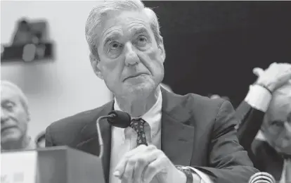  ?? JONATHAN ERNST REUTERS ?? Former Special Counsel Robert Mueller testifies before a House Judiciary Committee hearing on the Office of Special Counsel's investigat­ion into Russian interferen­ce in the 2016 U.S. election on Capitol Hill in Washington on Wednesday.
•