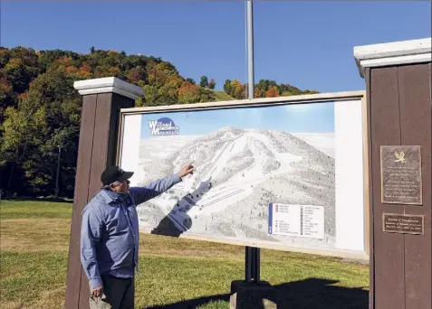  ?? Will Waldron / Times Union ?? Chic Wilson, owner of Willard Mountain, points to a trail map at his ski resort in Greenwich.