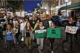  ?? ADAM CAIRNS / DISPATCH ?? Hundreds of Ohio University students march in Athens on Thursday as part of “It’s On Us, Bobcats,” a student-led protest against sex crimes.
