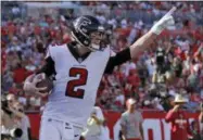  ?? MARK LOMOGLIO - THE ASSOCIATED PRESS ?? FILE - In this Dec. 30, 2018, file photo, Atlanta Falcons quarterbac­k Matt Ryan (2) celebrates after catching a 5-yard touchdown pass from Mohamed Sanu during the second half of an NFL football game against the Tampa Bay Buccaneers in Tampa, Fla.