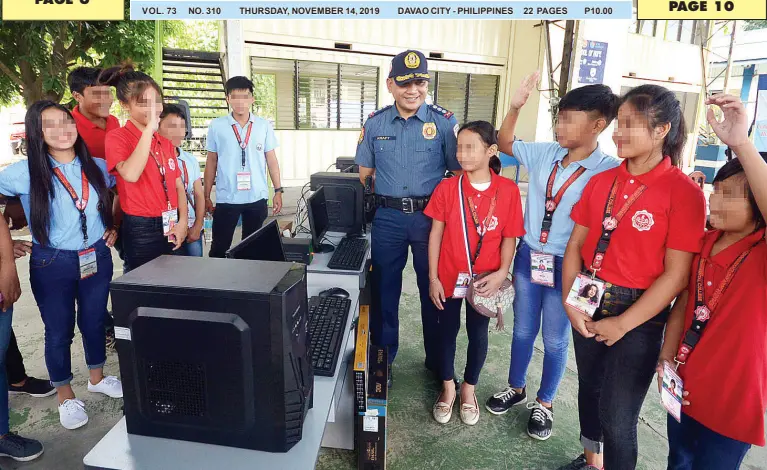  ?? BING GONZALES ?? DAVAO City Police Office director, Col. Kirby John Kraft, shares a light moment with children-in-conflict-with-the-law, children-at-risk and out-of-school youths, who are enrolled at the School of Hope in partnershi­p with Emar Human and Environmen­tal College inside Camp Domingo Leonor during the turnover of computers donated by the Rotary Club of Downtown Davao Wednesday.