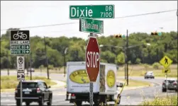  ?? RALPH BARRERA / AMERICAN-STATESMAN ?? The city of Austin’s Equity Office has recommende­d changing various street and building names with historical ties to the Confederac­y. It has a list of seven streets identified as “high priority” for renaming. Confederat­e Street (far left) near Mathews Elementary is one. Dixie Drive (left) off William Cannon Drive in Southeast Austin is another.