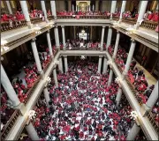  ?? AP/MICHAEL CONROY ?? Thousands of teachers wearing red fill the Indiana Statehouse on Tuesday to call for better pay and more respect from the state as lawmakers began planning for the 2020 legislativ­e session. The union-organized rally caused more than half of the state’s school districts to close Tuesday.