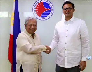  ?? ?? TRANSPORTA­TION Secretary Jaime Bautista congratula­tes new Land Transporta­tion Office chief Jay Art Tugade.