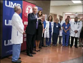  ?? DOUG MILLS/THE NEW YORK TIMES ?? President Donald Trump and first lady Melania Trump meet with doctors and medical workers after visiting shooting victims Oct. 4 at University Medical Center.