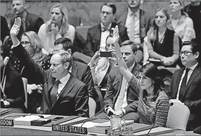  ?? [MARK LENNIHAN/THE ASSOCIATED PRESS] ?? Matthew Rycroft, left, Britain’s ambassador to the U.N., and Nikki Haley, right, the U.S. ambassador, vote in the favor of the resolution on North Korean sanctions Friday in New York.