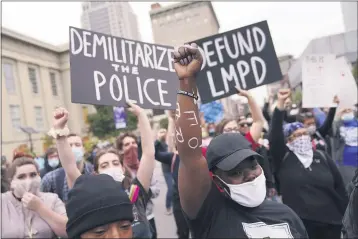  ?? JOHN MINCHILLO — THE ASSOCIATED PRESS FILE ?? Protesters demonstrat­e in Louisville, Ky.