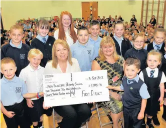  ??  ?? New start Catherine Meechan is pictured on the right at her current school, High Blantyre