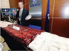  ??  ?? Massive haul: Comm Noor Rashid showing the seized drugs during a press conference in Kuala Lumpur yesterday. — Bernama