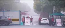  ??  ?? A checkpoint is seen at a residentia­l community in Shanghai, China, as the country is hit by an outbreak of the novel coronaviru­s yesterday.