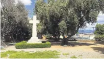  ?? KARLMONDON/STAFF ?? Andrew Defaria, a Santa Clara atheist, and the Freedom From Religion Foundation are suing the city of Santa Clara to force the removal of this large granite cross erected in 1953 on the grounds of a public park.