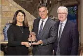  ?? [PHOTO PROVIDED] ?? Oklahoma City University President Martha Burger and former OCU President Robert Henry, far right, present the Rev. Craig Groeschel, founding senior pastor of Life. Church, with the university’s Servant Leadership Award.Oklahoma City University President Martha Burger poses for a picture with the Rev. Craig Groeschel, founding senior pastor of Life.Church,