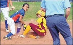  ?? GREG SORBER/JOURNAL ?? West Mesa shortstop Desiree Gurule, left, looks to the umpire as she tags Valley’s Raelyn Sanchez at second base in the second inning of their game Tuesday at Valley High.
