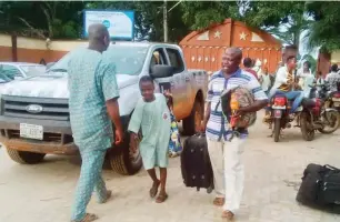  ??  ?? Parents of Igbonla waiting to pick their children/wards after news of the incident was announced