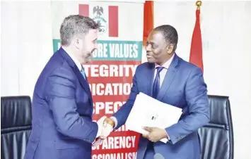  ?? ?? Secretary to the National Drug
Law Enforcemen­t Agency (NDLEA) Shadrach Haruna (right) and the deputy assistant scretary, US State Department, Mr. Tobin Bradley, when the latter led a team of US officials to hand over some equipment provided by the INL to enhance the operations of the agency at its national headquarte­rs in Abuja yesterday PHOTO BY NDLEA