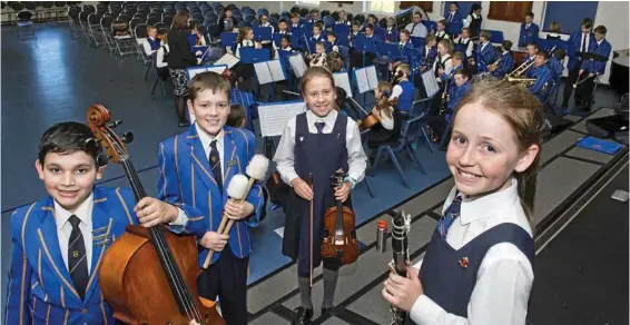  ?? PHOTO: NEV ?? TALENT IN ABUNDANCE: Playing in a combined orchestra are (from left) Bede Davis, Thomas Dixon, Tyler Kinkema and Gabrielle Waterfall. MADSEN