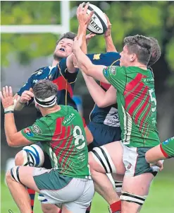  ?? Pictures: Kim Cessford. ?? Top: High’s Neil Turnbull goes down under a GHA challenge; right: Paul Rich evades two tackles as the hosts take the game to the visitors; above: players challenge for a high ball.