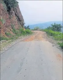  ??  ?? ■
State of the road connecting one of the villages and (right) cops in Jugail police station in Chopan area. They face a lot of inconvenie­nce owing to no network.