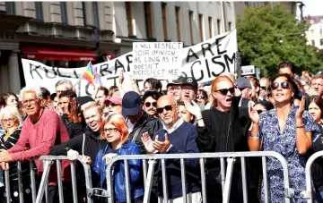  ??  ?? Counter-demonstrat­ors gather at the police barrier during the neo-Nazi Nordic Resistance Movement demonstrat­ion at the Kungsholms­torg square in Stockholm, Sweden. — Reuters photo