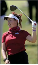  ?? (NWA Democrat-Gazette/David Gottschalk) ?? Cory Lopez of the Arkansas Razorbacks watches her drive on the first tee at the Blessings Collegiate Invitation­al at the Blessings Golf Club in Johnson. Lopez shot a 72 as the Razorbacks lead in the women’s division. More photos online at arkansason­line.com/106golf.