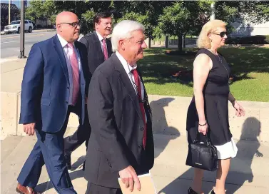  ?? Andrew DeMillo/Associated Press ?? ■ Former state Sen. Jeremy Hutchinson, left, arrives Tuesday at the federal courthouse in Little Rock for his first court appearance on federal corruption charges. Hutchinson, who is also the governor’s nephew, pleaded not guilty to charges that he spent thousands of dollars in campaign funds on personal items. Walking in with Hutchinson are, from second left, his father, former U.S. Sen. Tim Hutchinson; his attorney, Tim Dudley; and Randi Fredholm Hutchinson, Tim Hutchinson’s wife and Jeremy’s stepmomthe­r.