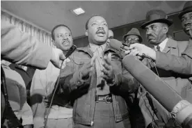  ?? ?? The Rev Ralph Abernathy, left, and the Rev Dr Martin Luther King Jr speak to the press in Birmingham, Alabama. Photograph: Bettmann/Corbis via Getty Images