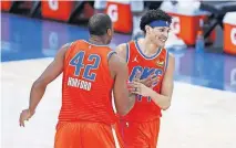  ??  ?? Thunder center Al Horford (42) and forward Justin Jackson (44) celebrate after Jackson hit a 3-pointer late in a 114-109 win against the Bucks on Sunday. [ALONZO ADAMS/USA TODAY SPORTS]