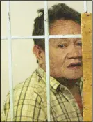  ?? EDD GUMBAN ?? Rape suspect Rodolfo Astorga looks out from his cell at the Manila Police District headquarte­rs yesterday.