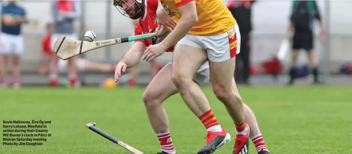  ??  ?? Kevin Hallassey, Éire Óg and Garry Lehane, Mayfield in action during their County IHC Round 3 clash in Páirc Uí Rinn on Saturday evening Photo by Jim Coughlan