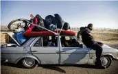  ?? MOHAMMED DAHMAN / AP ?? Palestinia­ns flee the Israeli offensive in Khan Younis, Gaza Strip, where fighting has displaced tens of thousands of people, on Wednesday.