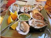  ??  ?? Fresh oysters from nearby Scow Bay Oyster Farm are available at the ajax Cafe in Port Hadlock.