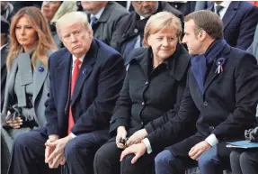  ?? FRANCOIS MORI/AP ?? Former President Donald Trump watches as French President Emmanuel Macron chats with German Chancellor Angela Merke in November 2018 in Paris. European allies are closely watching the possibilit­y of another Trump term.