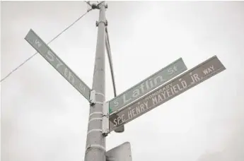  ?? ANTHONY VAZQUEZ/SUN-TIMES ?? The street sign for Army Spc. Henry Mayfield Jr. at 57th and Laflin streets.