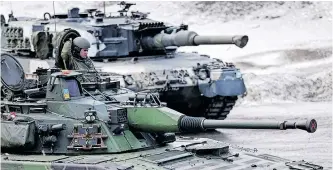  ?? REUTERS ?? SWEDISH and Finnish tanks are seen during a military exercise called ‘Cold Response 2022’ in Evenes, Norway, this week, where Nato has gathered nearly 30 000 troops from its member countries, amid Russia’s invasion of Ukraine. |