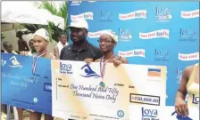  ??  ?? The Category Manager, Diary, Promasidor Nigeria Limited, Mr. Abiodun Ayodeji, with Shukunyys Rabiu (M) from Grange School, first prize winner in the 25 metres freestyle relay for girls, Chantel Watson (L), from Children's Internatio­nal School, who...