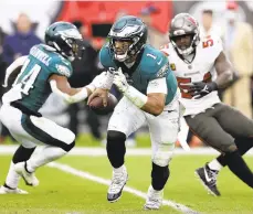  ?? MARK LOMOGLIO/AP ?? Eagles quarterbac­k Jalen Hurts runs with the ball during a Jan. 16 NFC wild-card game against the Tampa Bay Buccaneers in Tampa, Florida.