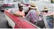  ??  ?? TOURISTS ride in a vintage car in Havana, Cuba. The US this week imposed restrictio­ns on travel to Cuba that will be a blow for Cuban business.