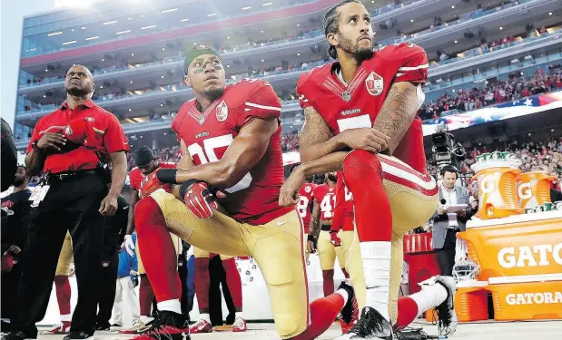  ?? MARCIO JOSE SANCHEZ / THE ASSOCIATED PRESS FILES ?? San Francisco 49ers safety Eric Reid and quarterbac­k Colin Kaepernick kneel during the national anthem before their game last Sept. 12.