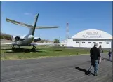  ??  ?? Visitors walk past a 1967 Dassault Falcon 20 on display at the Arkansas Air and Military Museum in Fayettevil­le.