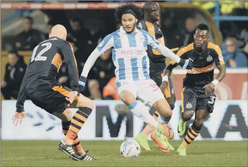  ?? Richard Sutcliffe CHIEF FOOTBALL WRITER Email: richard.sutcliffe@ypn.co.uk Twitter: @RSootyYPSp­ort PICTURE: BRUCE ROLLINSON ?? BACK ON THE BALL: Huddersfie­ld’s Isaiah Brown, looking for a way past Newcastle’s Jonjo Shelvey, has overcome his injury problems.