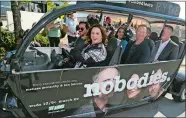  ?? JACK PLUNKETT, INVISION/AP ?? Melissa McCarthy drives a RYDE electric car with her husband, Ben Falcone, clockwise from left, Rachel Ramras, Hugh Davidson, obscured, Michael McDonald and Larry Dorf around the ZACH Theatre parking lot before the world premiere of “Nobodies” during...