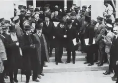  ?? (Getty) ?? Allied delegates leave Trianon Palace during the 1919 Versailles peace talks