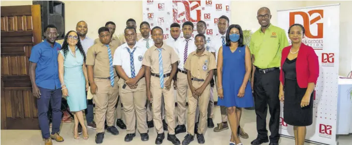  ?? ?? The D&G Foundation team joins Member of Parliament for St Thomas Eastern, Dr Michelle Charles (third from right), and some of the mentored young men for a photo opportunit­y at the launch of the foundation’s ‘No Male Left Behind’ initiative at the Golden Shore Resort in St Thomas.