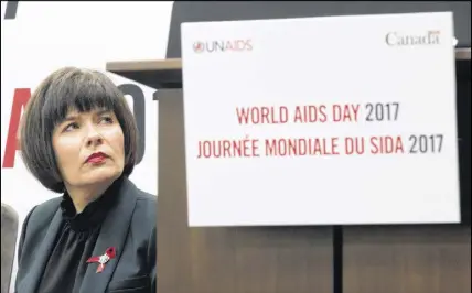  ?? CP Photo ?? Minister of Health Ginette Petitpas Taylor listens to a speaker during an event marking World AIDS Day in Ottawa on Friday.